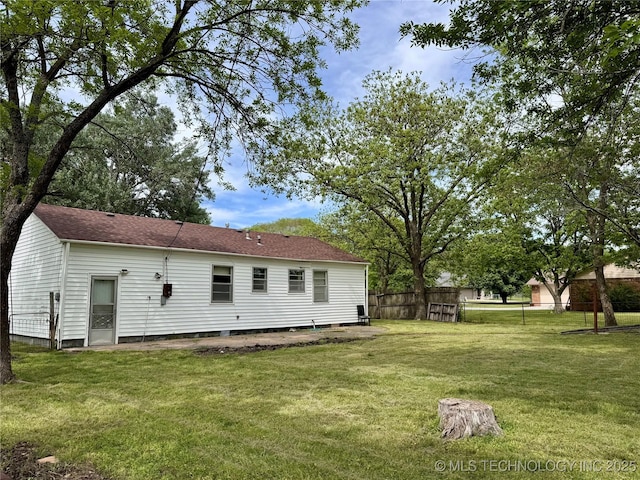 back of property featuring roof with shingles