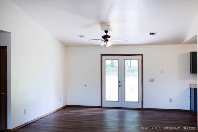 interior space with ceiling fan, french doors, wood finished floors, and visible vents