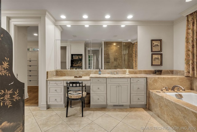 2119 E 30th Pl, Tulsa, OK 74114 - bathroom featuring tile patterned floors, a bath, vanity, ornamental molding, and recessed lighting