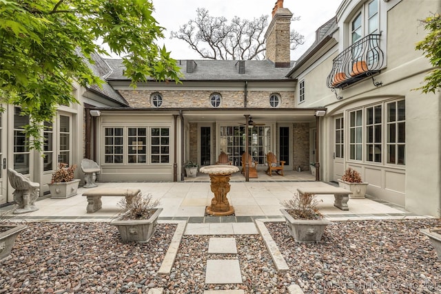 2119 E 30th Pl, Tulsa, OK 74114 - back of house with a high end roof, a patio, a chimney, and french doors