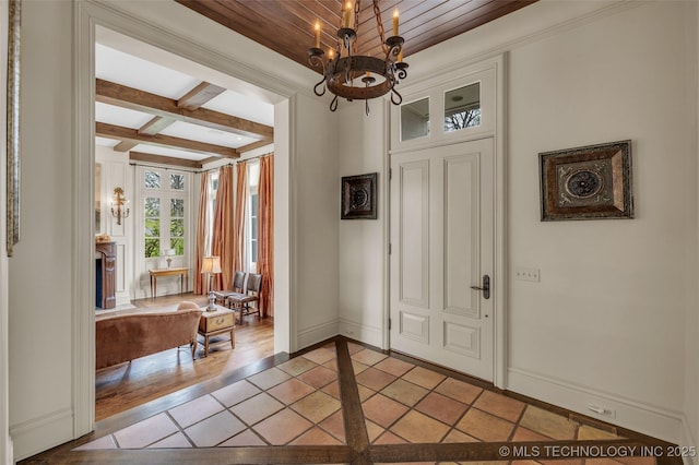 2119 E 30th Pl, Tulsa, OK 74114 - entryway featuring coffered ceiling, a chandelier, baseboards, and beamed ceiling