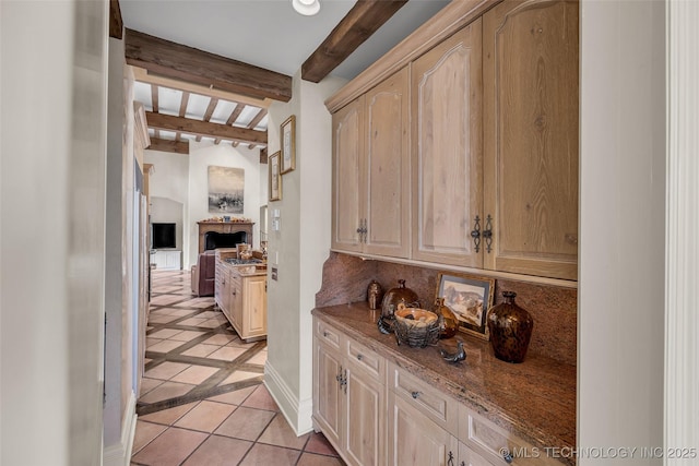 2119 E 30th Pl, Tulsa, OK 74114 - hallway featuring light tile patterned floors, baseboards, and beam ceiling