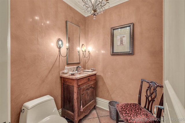 2119 E 30th Pl, Tulsa, OK 74114 - bathroom featuring toilet, vanity, ornamental molding, tile patterned floors, and a notable chandelier