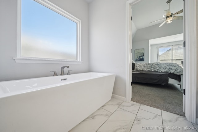 10431 S 232nd E Ave, Broken Arrow, OK 74014 - ensuite bathroom with marble finish flooring, a freestanding bath, and ceiling fan