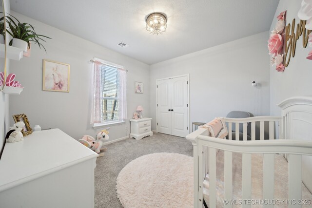 10431 S 232nd E Ave, Broken Arrow, OK 74014 - bedroom featuring light colored carpet, a closet, a nursery area, and baseboards