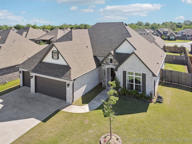 10431 S 232nd E Ave, Broken Arrow, OK 74014 - french country home featuring a garage, brick siding, roof with shingles, and driveway