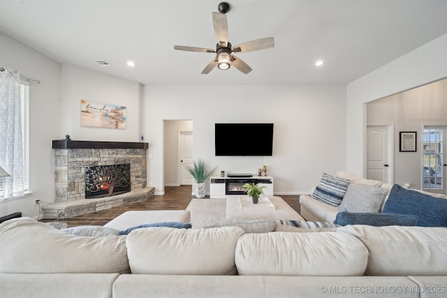 10431 S 232nd E Ave, Broken Arrow, OK 74014 - living room with a stone fireplace, wood finished floors, ceiling fan, recessed lighting, and baseboards