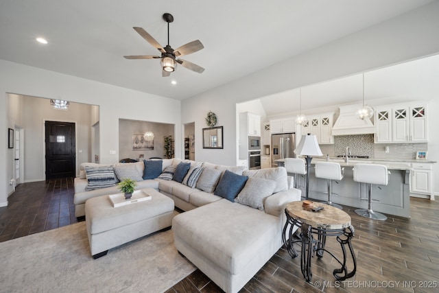 10431 S 232nd E Ave, Broken Arrow, OK 74014 - living area featuring dark wood finished floors, a ceiling fan, recessed lighting, baseboards, and lofted ceiling