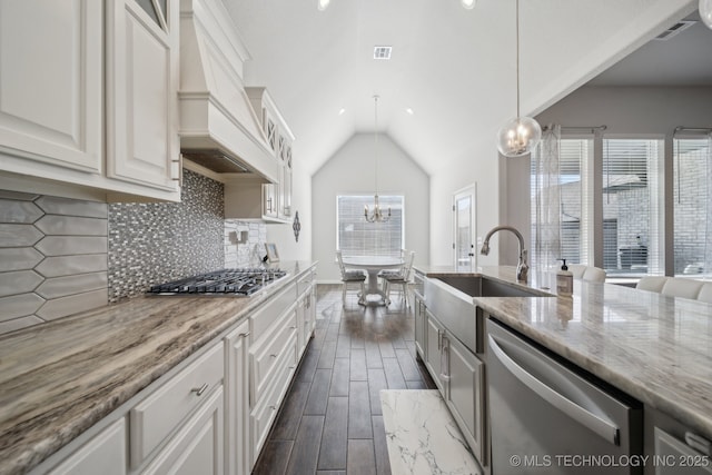 10431 S 232nd E Ave, Broken Arrow, OK 74014 - kitchen featuring stainless steel appliances, a chandelier, a sink, lofted ceiling, and dark wood-type flooring