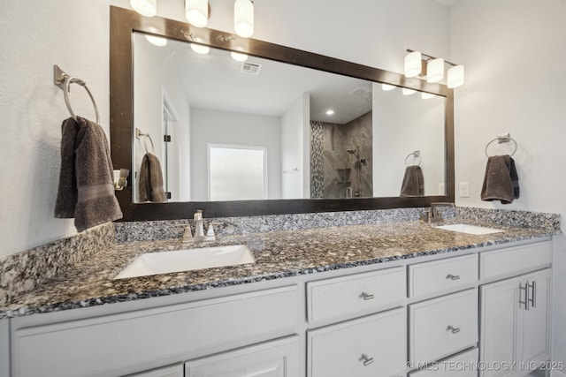 10431 S 232nd E Ave, Broken Arrow, OK 74014 - bathroom featuring double vanity and a tile shower