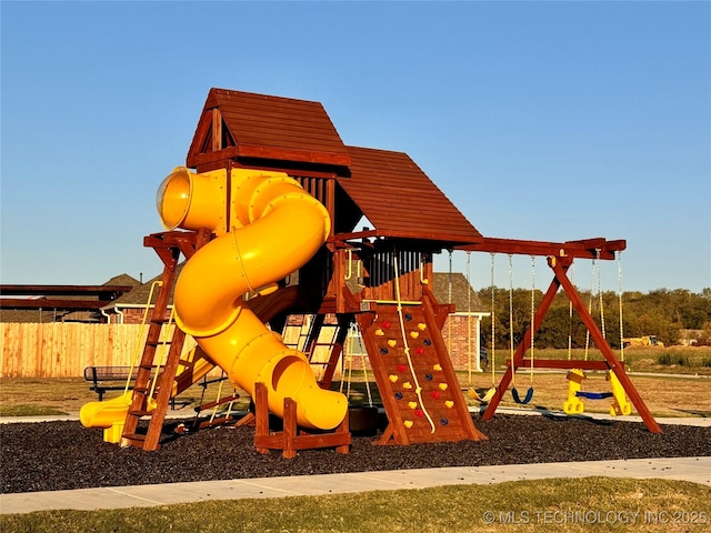 communal playground featuring fence