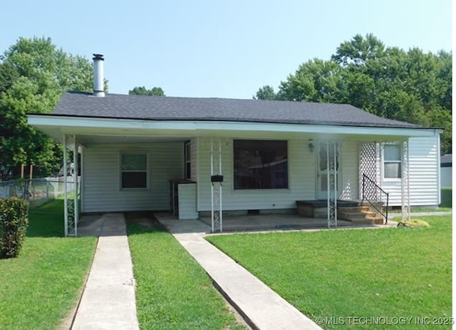 bungalow with a front lawn and fence