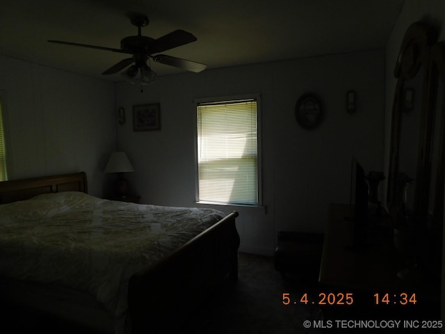 carpeted bedroom with a ceiling fan