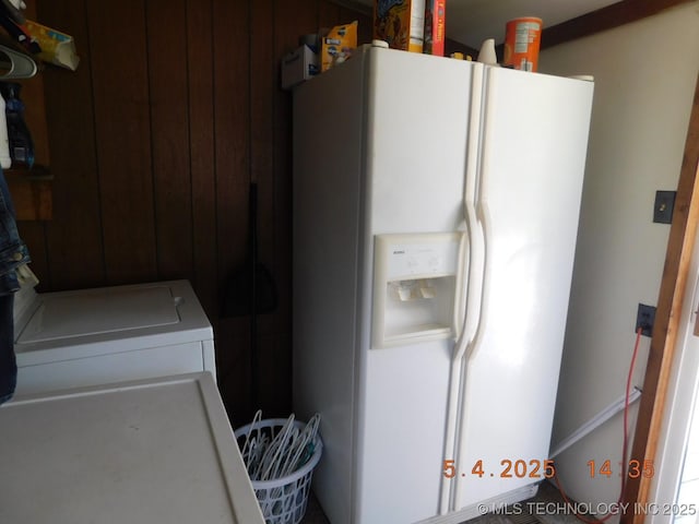 clothes washing area with cabinet space
