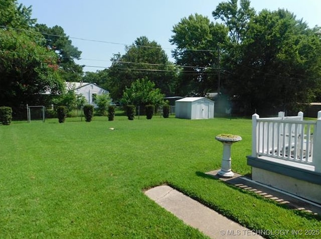 view of yard with an outbuilding and a shed