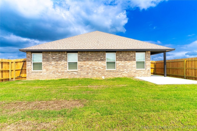 10914 S 272nd E Ave, Coweta, OK 74429 - back of house with a shingled roof, a fenced backyard, a patio, and brick siding