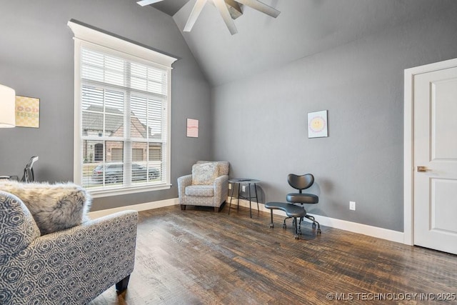 sitting room with wood finished floors, a ceiling fan, a healthy amount of sunlight, and lofted ceiling
