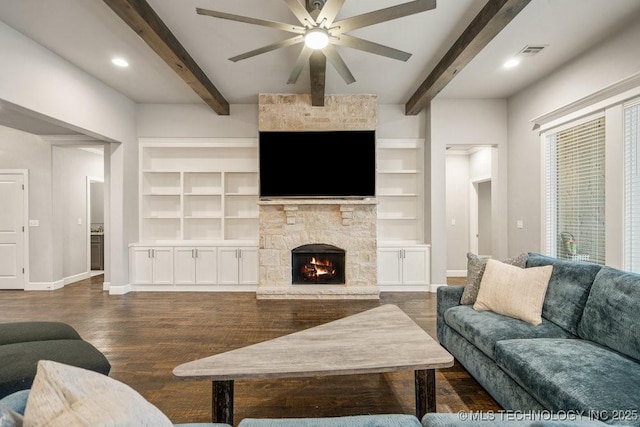 living area featuring beam ceiling, visible vents, dark wood finished floors, a ceiling fan, and baseboards