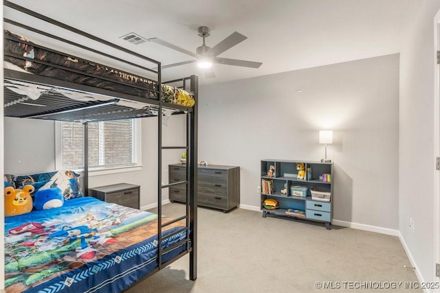 bedroom featuring baseboards, a ceiling fan, visible vents, and carpet floors