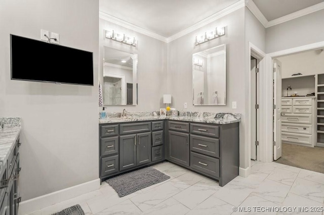 full bath featuring vanity, ornamental molding, baseboards, and marble finish floor