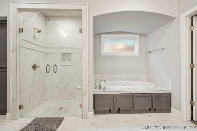 full bathroom with a marble finish shower, a garden tub, and marble finish floor