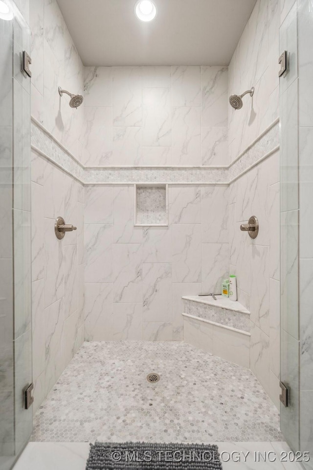 bathroom featuring a shower stall and recessed lighting