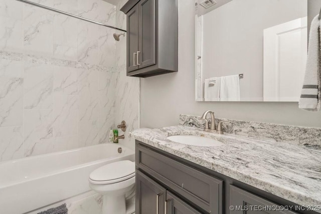 bathroom with toilet,  shower combination, visible vents, marble finish floor, and vanity