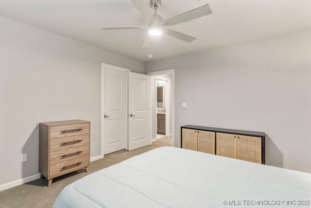 bedroom featuring light carpet, baseboards, and ceiling fan