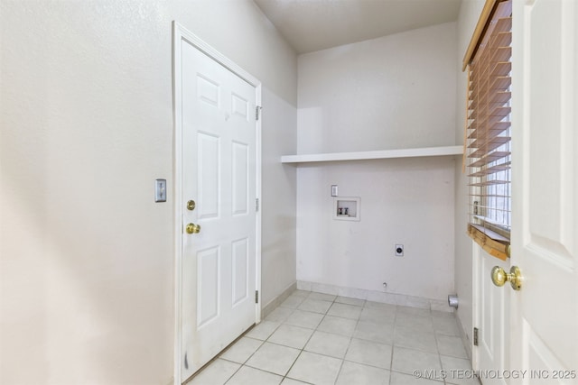 laundry area featuring washer hookup, electric dryer hookup, and light tile patterned floors