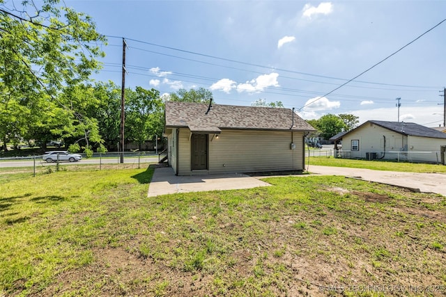 exterior space featuring fence, a patio, and a front lawn