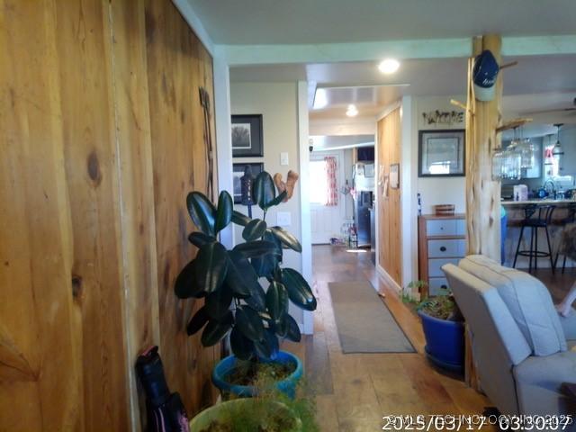 hallway featuring plenty of natural light and wood finished floors