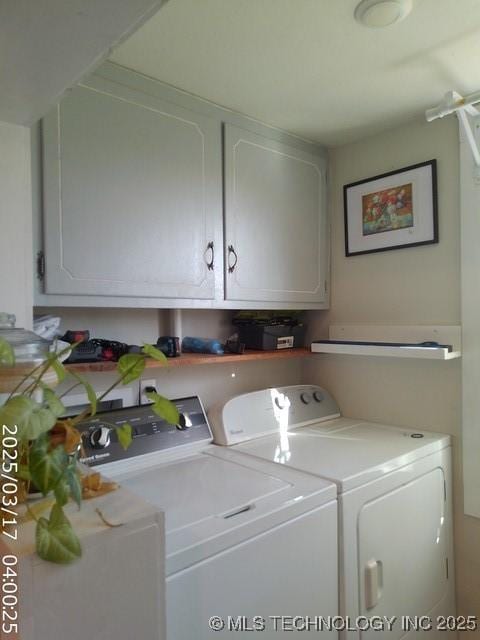 laundry room with washer and dryer and cabinet space