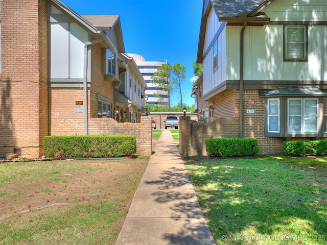 view of property's community with a lawn