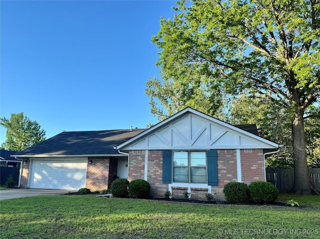 606 Rosewood Ct, Claremore, OK 74017 - view of front of home featuring a garage, brick siding, and driveway