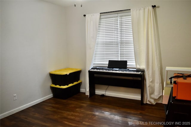 606 Rosewood Ct, Claremore, OK 74017 - misc room featuring dark wood-style flooring and baseboards