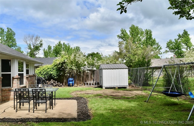 606 Rosewood Ct, Claremore, OK 74017 - view of yard featuring a storage shed, a patio, and an outdoor structure