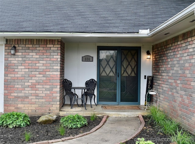 606 Rosewood Ct, Claremore, OK 74017 - doorway to property with brick siding and a shingled roof