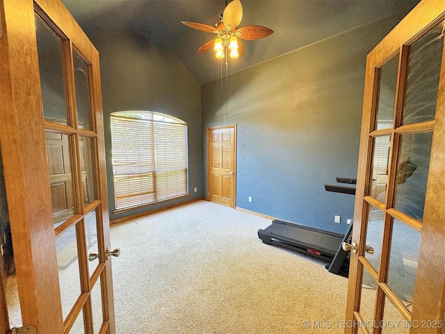 workout area with french doors, baseboards, carpet flooring, ceiling fan, and high vaulted ceiling