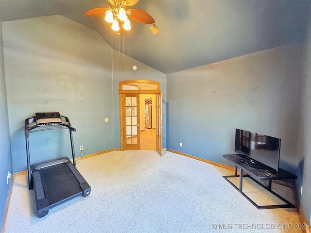 exercise area with a ceiling fan, baseboards, carpet, and vaulted ceiling