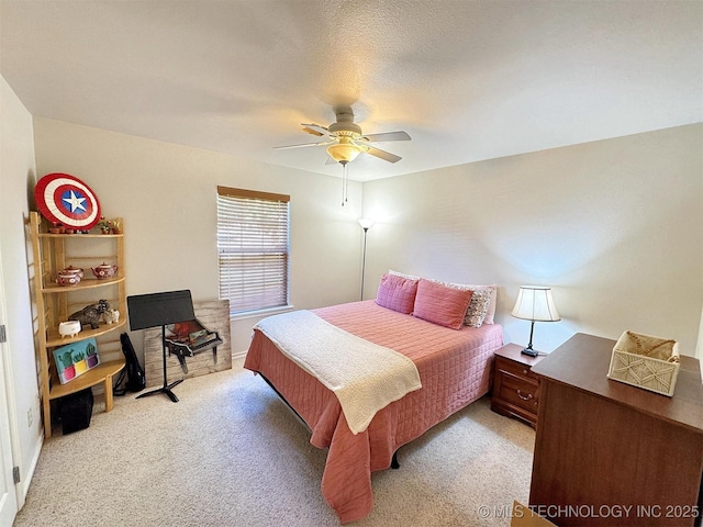 bedroom with ceiling fan and light carpet