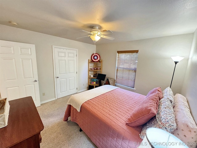 bedroom featuring light carpet, baseboards, and ceiling fan