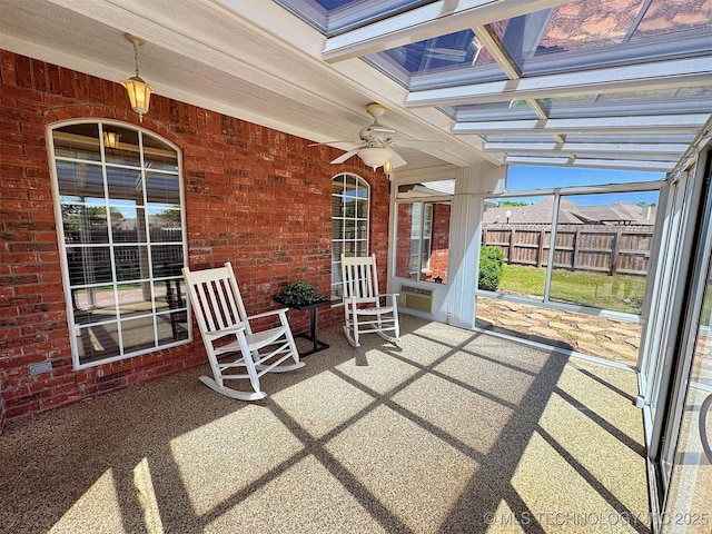 view of patio / terrace featuring a ceiling fan and fence