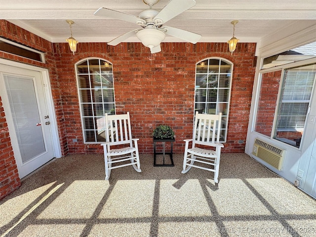 view of patio featuring a wall mounted air conditioner and a ceiling fan