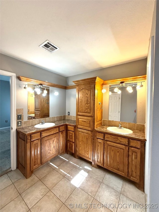 full bathroom with vanity and tile patterned flooring