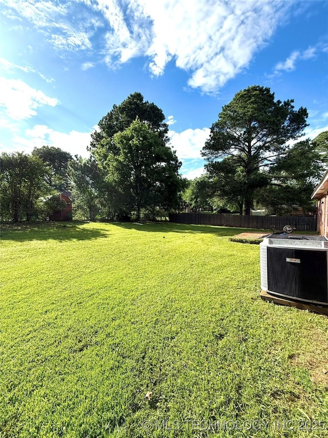 view of yard featuring central AC unit
