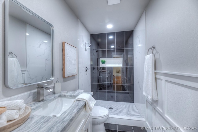 bathroom with a shower stall, recessed lighting, vanity, and toilet