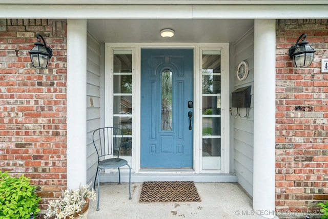 4721 S Irvington Pl, Tulsa, OK 74135 - view of exterior entry featuring brick siding