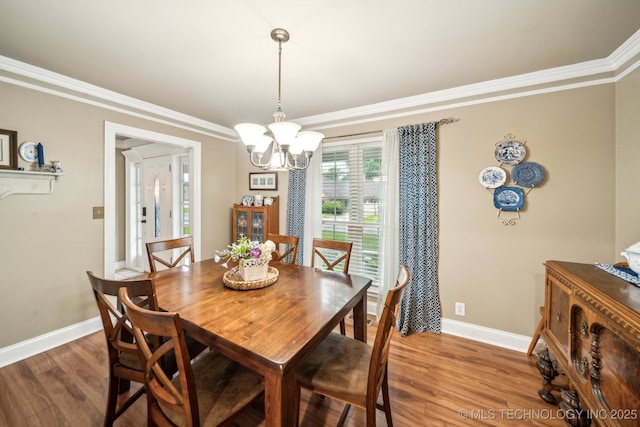 4721 S Irvington Pl, Tulsa, OK 74135 - dining room featuring ornamental molding, a chandelier, and wood finished floors