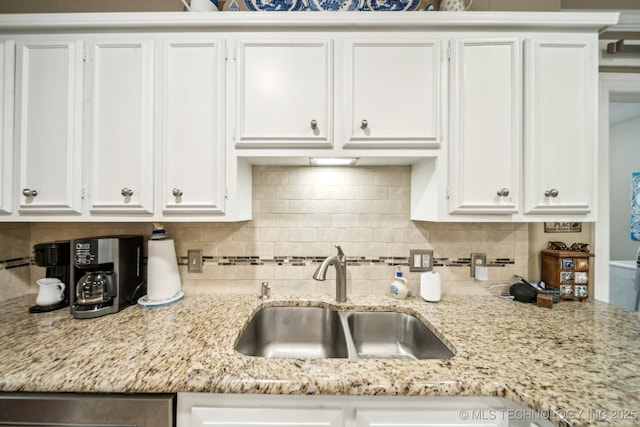 4721 S Irvington Pl, Tulsa, OK 74135 - kitchen with white cabinetry, decorative backsplash, and light stone countertops