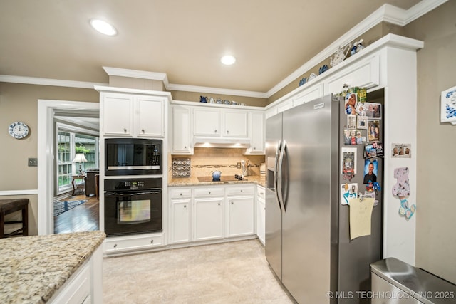 4721 S Irvington Pl, Tulsa, OK 74135 - kitchen with black appliances, crown molding, white cabinets, under cabinet range hood, and recessed lighting